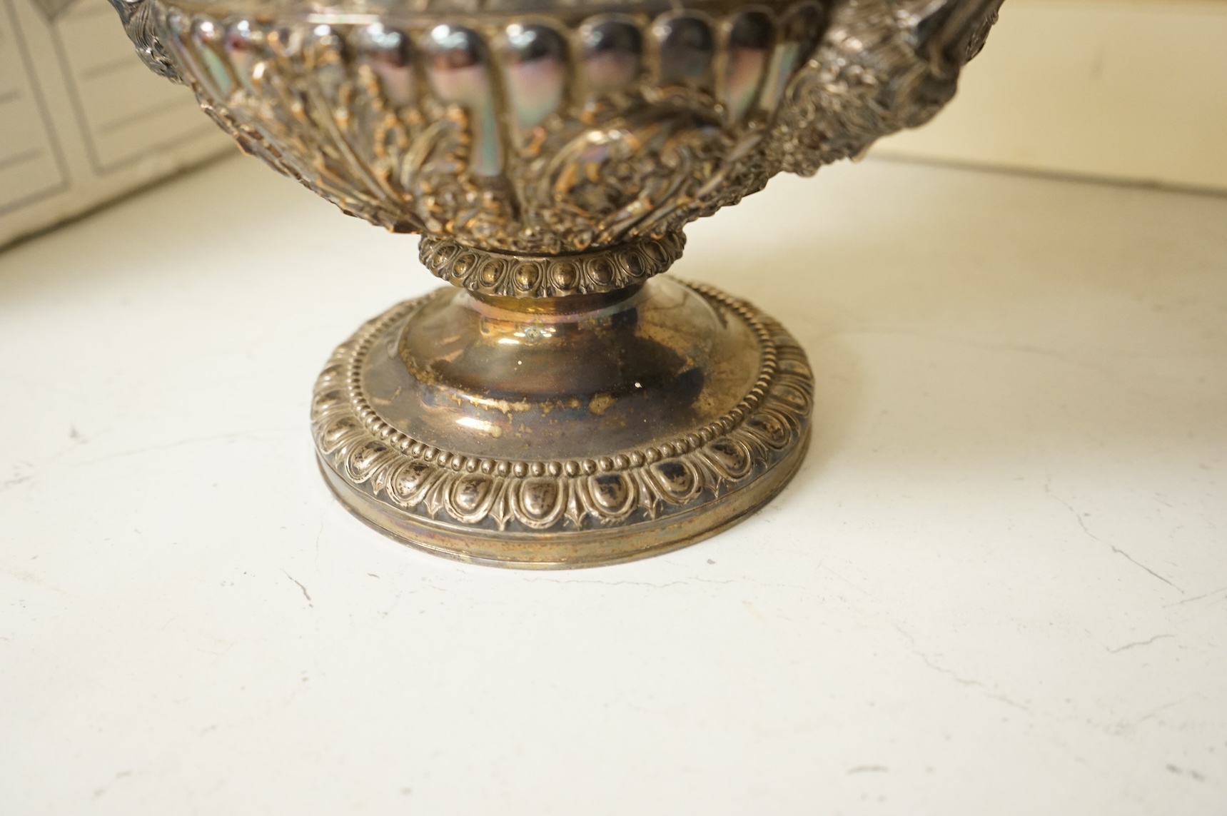 A Victorian silver plated campana wine cooler and removable liner, with vineous cast rim and bacchic mask twin handles, height 26cm.